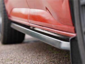 Alternative view of VW T7 2025> / Ford Transit Custom (MK2) 2024> Gloss Black Trapezoid Sidebars SWB